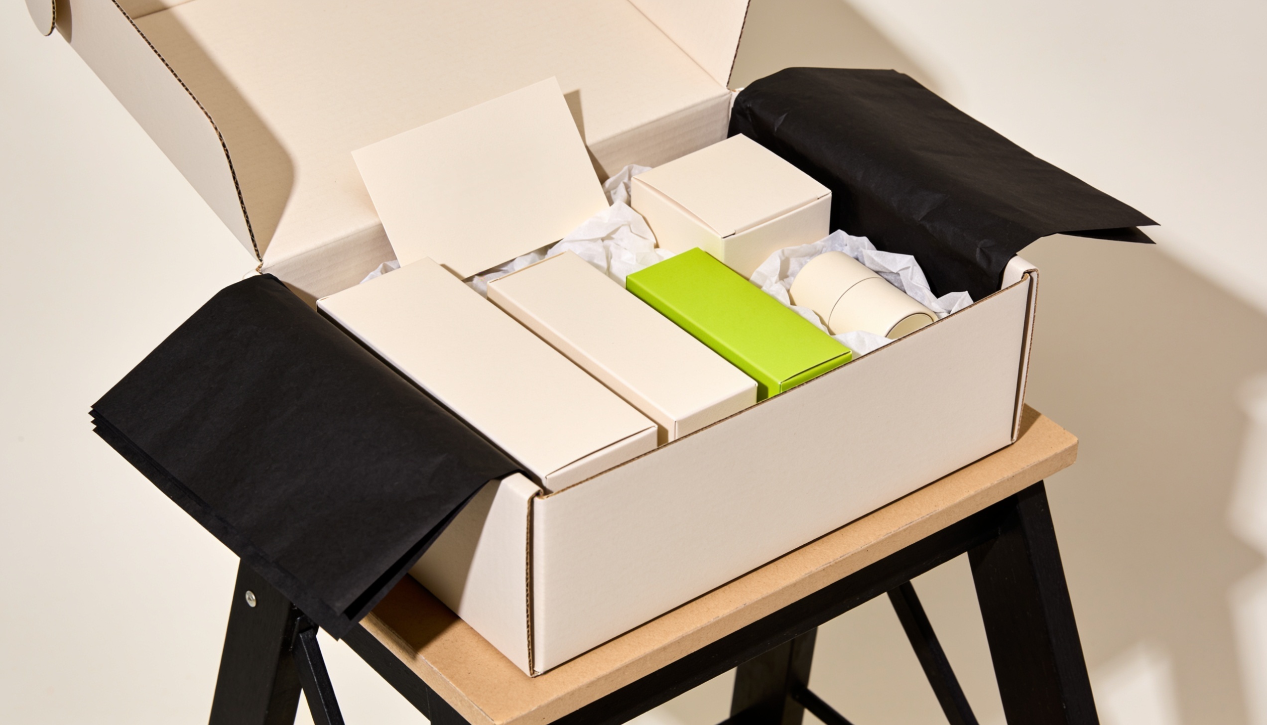 Kitting and subscription boxes — assembled gift boxes on a packing bench